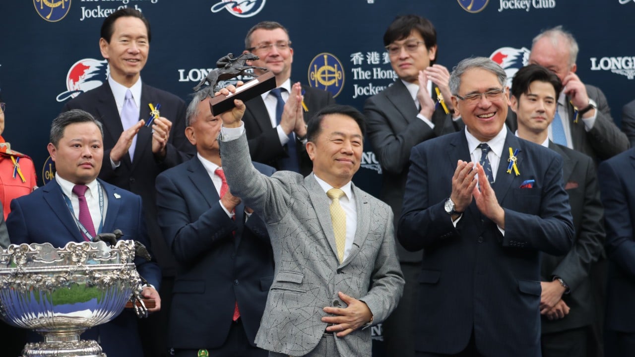 Trainer Ricky Yiu with the Hong Kong Mile trophy after Voyage Bubble’s win last Sunday.