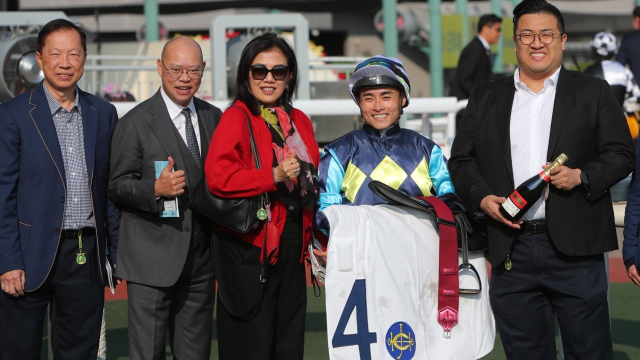 Trainer Chris So (second from left), jockey Keith Yeung and connections of Mount Everest celebrate.