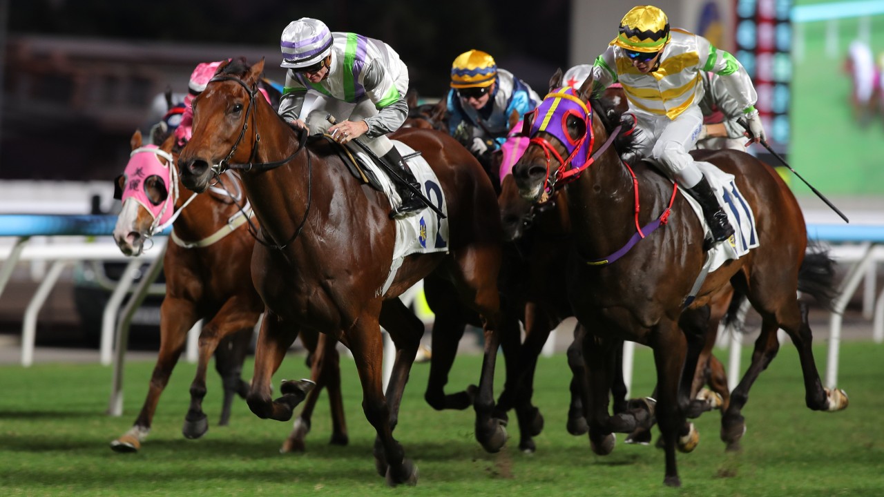Light Years Charm (white, purple and green) gets up to beat Aeris Nova at Sha Tin. Photos: Kenneth Chan