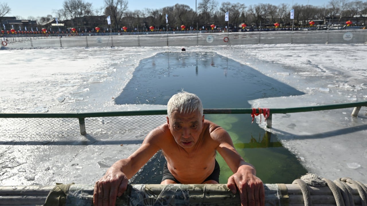 China’s winter swimmers plunge into frozen lake