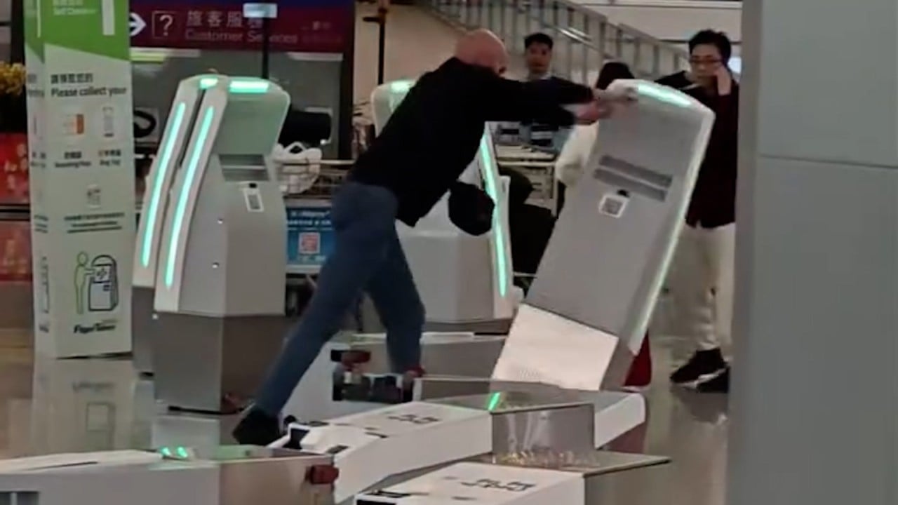 Man takes out his anger on Hong Kong airport kiosks