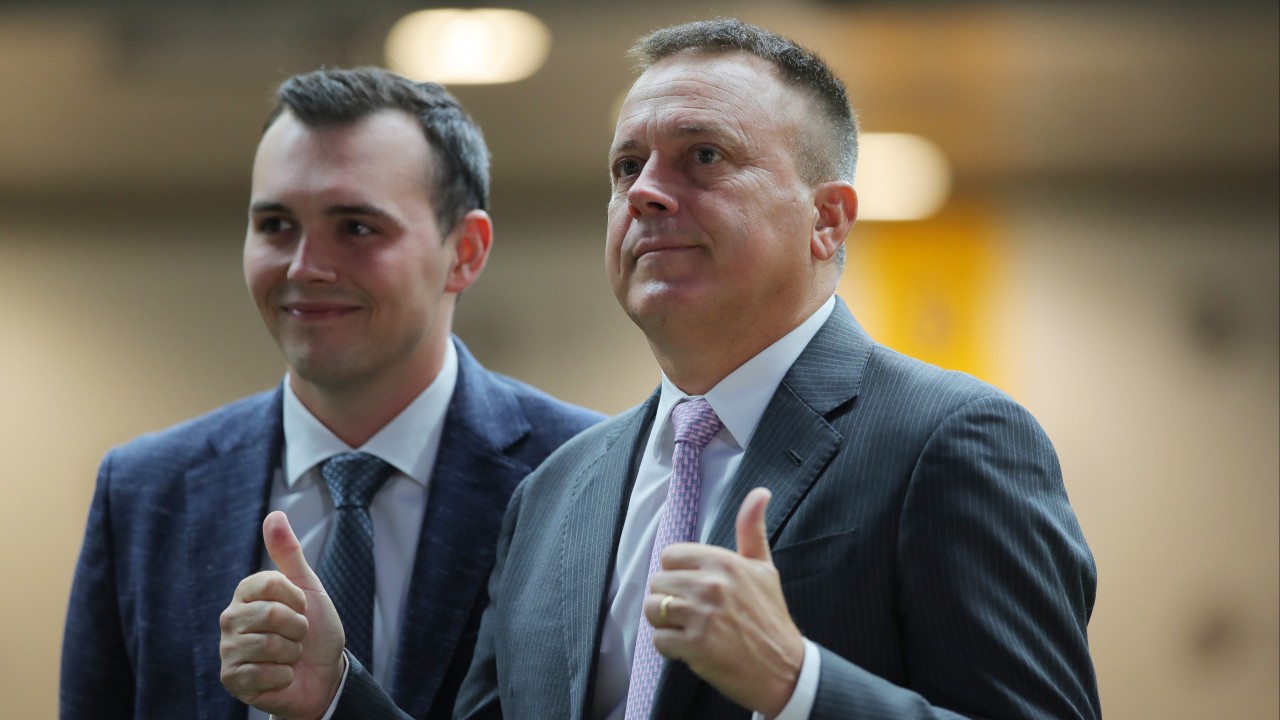 Caspar Fownes (right) and son Ronan celebrate the stable’s latest treble at the Valley. Photos: Kenneth Chan