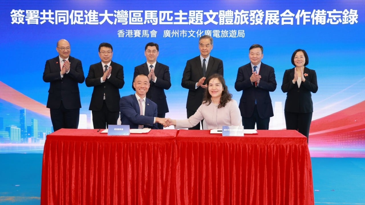 The Hong Kong Jockey Club's Ronald Chan (front left) and Guangzhou tourism bureau’s Li Ruolan (front right) signed the memorandum of understanding. Photo: HKJC