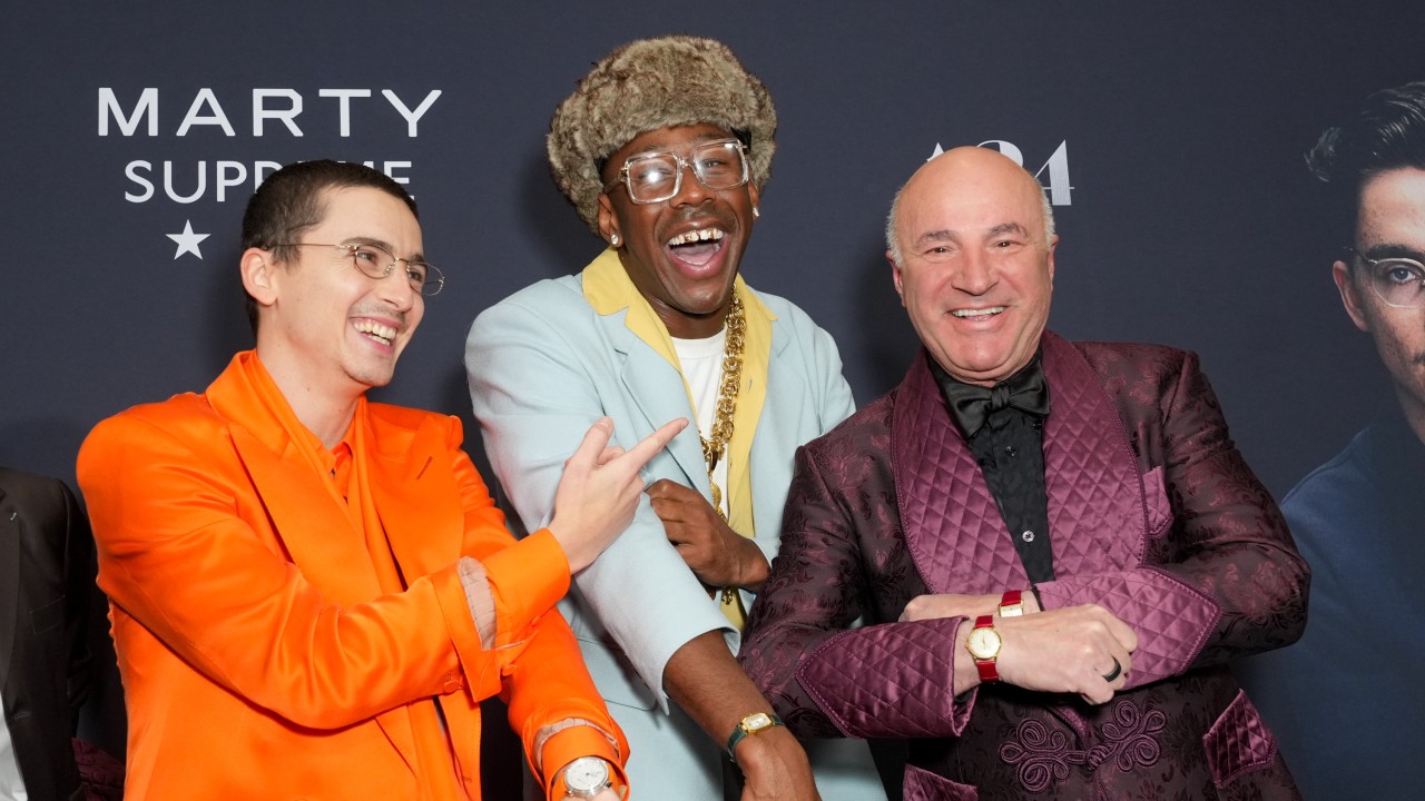 Timothée Chalamet, Tyler the Creator and Canadian businessman Kevin O’Leary show off watches with coloured straps at December’s New York premiere of Marty Supreme. Photo: Variety via Getty Images