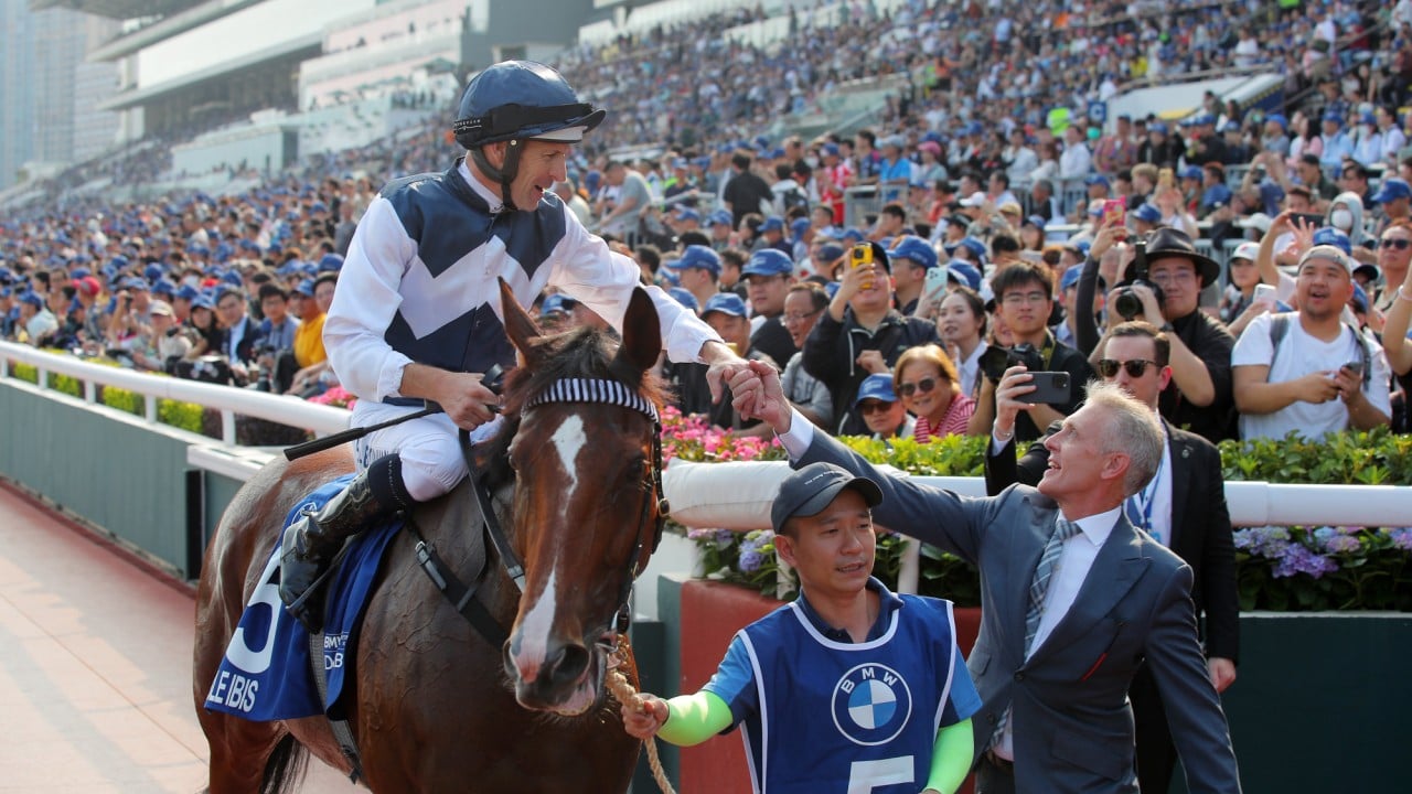 Jockey Hugh Bowman and trainer Mark Newnham celebrate Invincible Ibis’ Derby success.