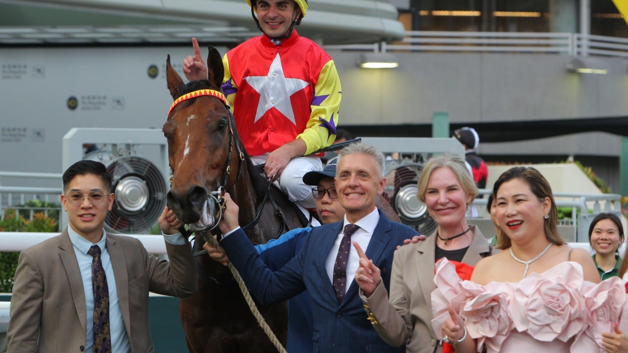 Andrea Atzeni and Mark Newnham celebrate the win of Crimson Flash alongside connections. 