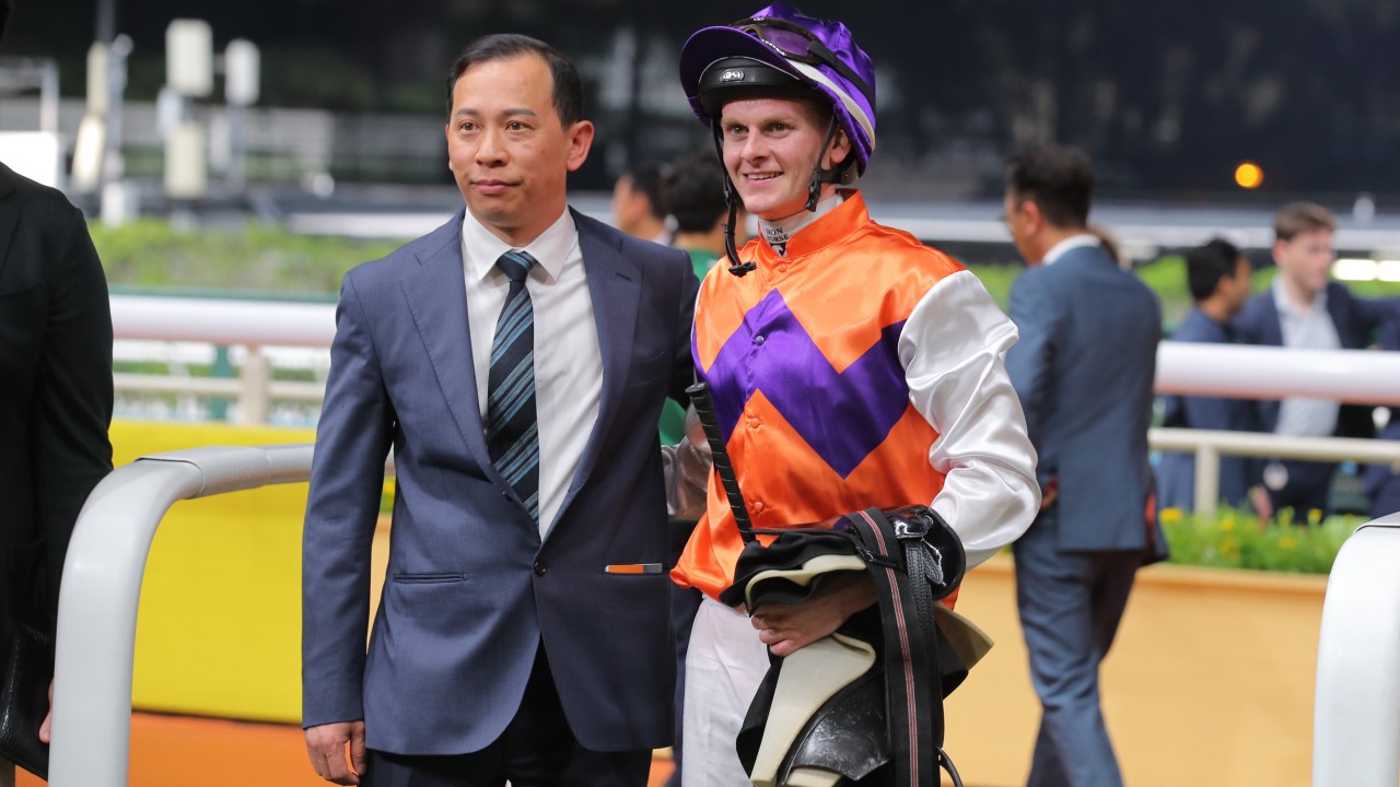 Jockey Ethan Brown celebrates his first Hong Kong win with trainer Cody Mo. Photos: Kenneth Chan