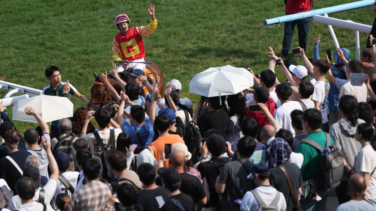 Hugh Bowman celebrates his Champions Mile triumph on My Wish.