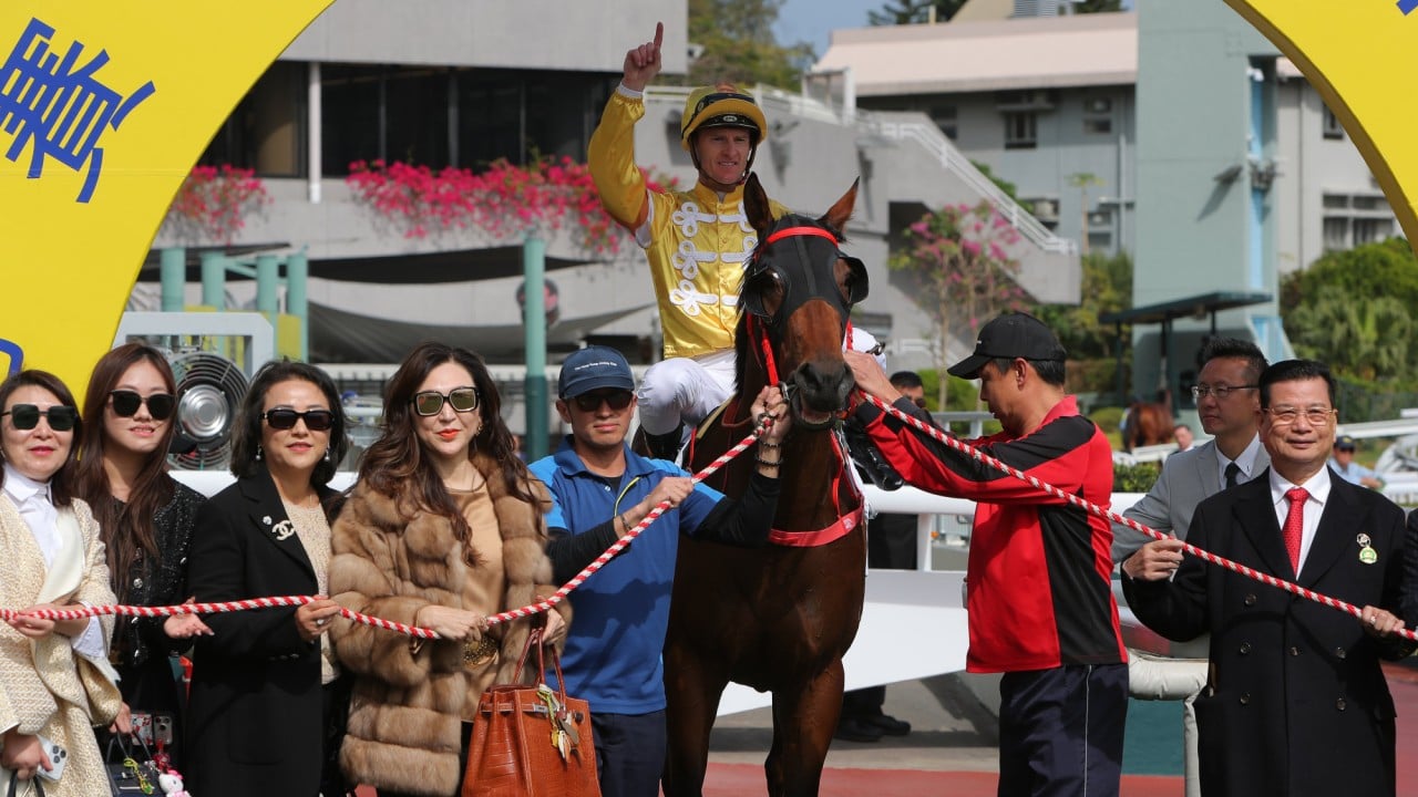 Connections celebrate the win of Crossborderdude at Sha Tin.