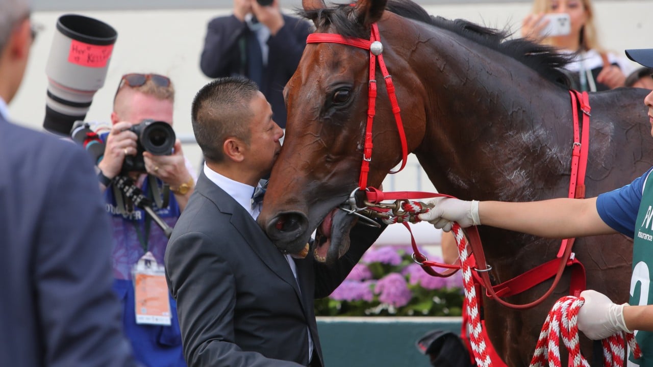 Danny Shum with Romantic Warrior after his fourth QEII Cup victory.