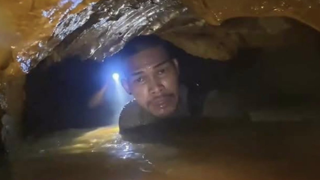 Rescuers race to save miners in flooded Laos cave