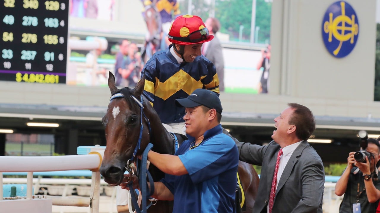 Joao Moreira and Caspar Fownes celebrate the win of Family Fortune at Happy Valley.