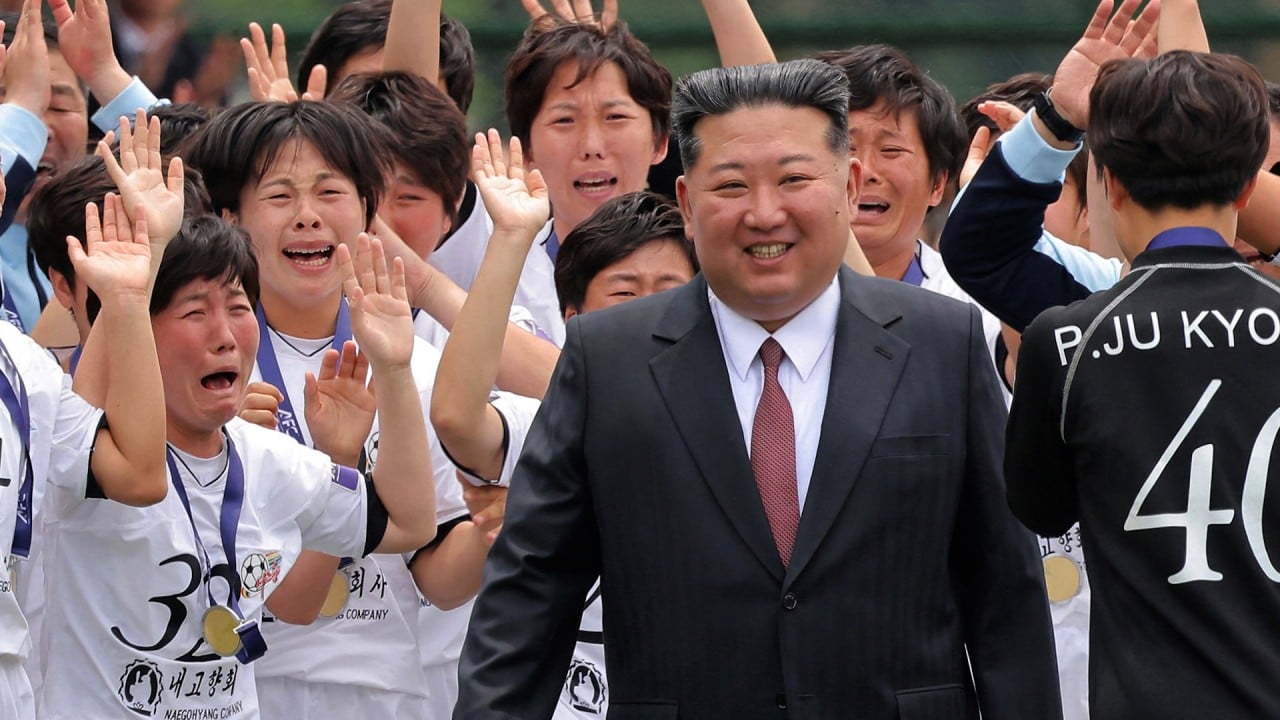 Kim meets North Korean footballers after historic win