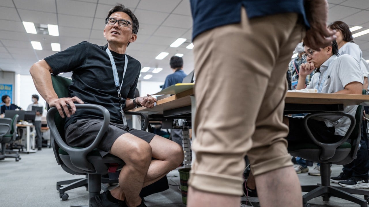 Japanese workers swap suits for shorts to save energy
