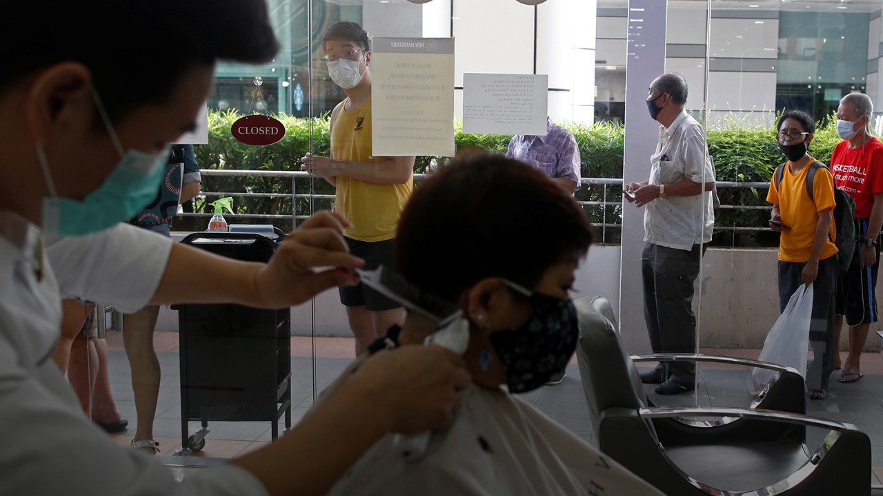 Singaporeans head to hair salons as some coronavirus measures slightly eased