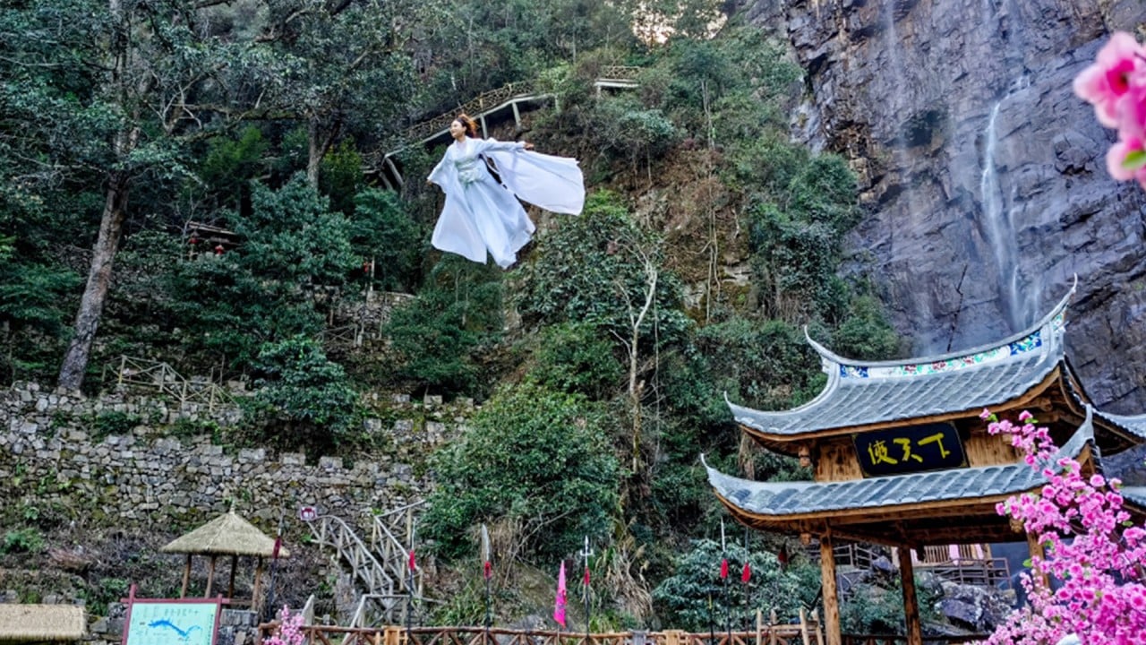 Dressed in costumes, tourists ‘fly’ into the sky to experience real life kung fu world