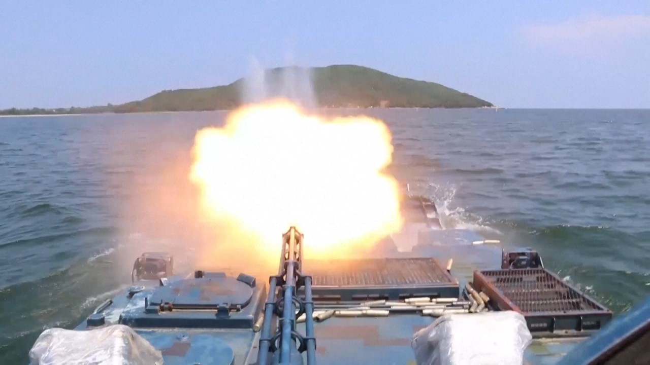 Chinese amphibious armoured troops conduct live-fire military exercise at sea 