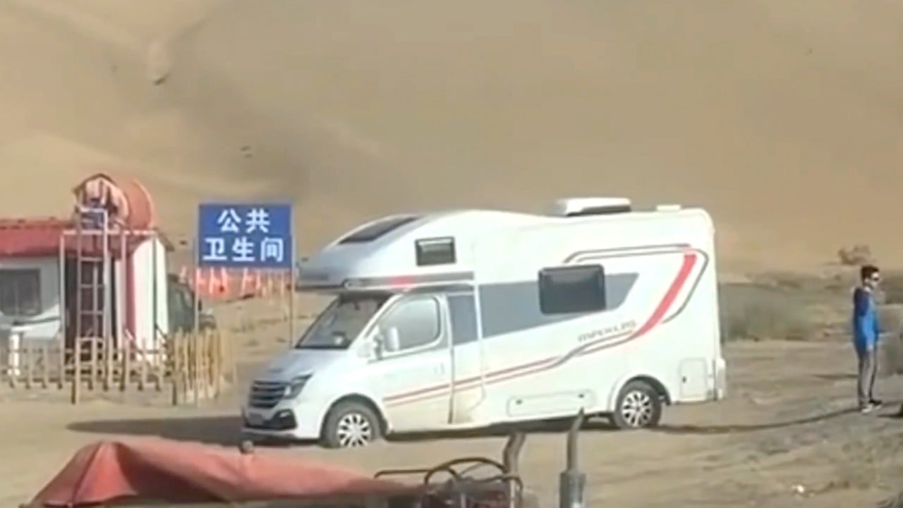 Public toilet in China built deliberately on soft sand to trap tourists’ vehicles