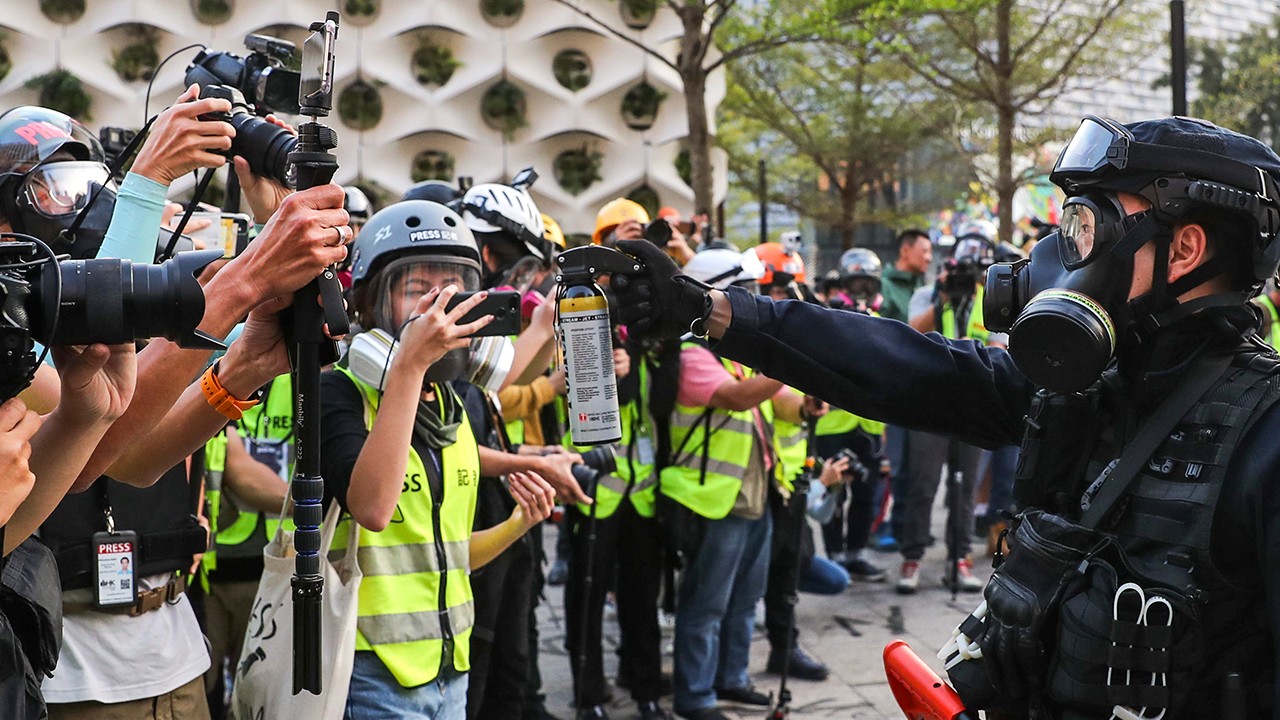 Hong Kong journalists protest against police’s new definition of ‘media representative’ 