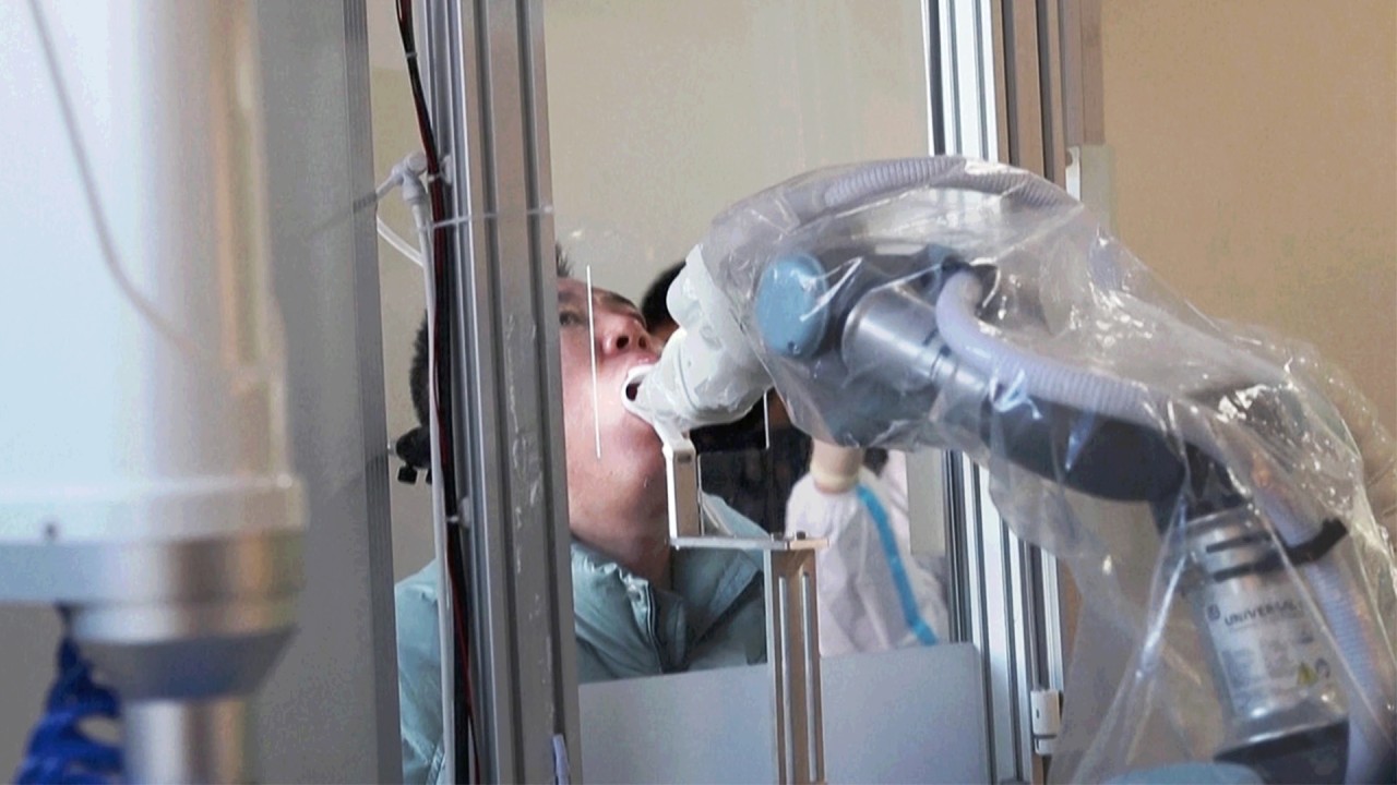 Robotic arm conducts Covid-19 tests as China fights coronavirus flare-up