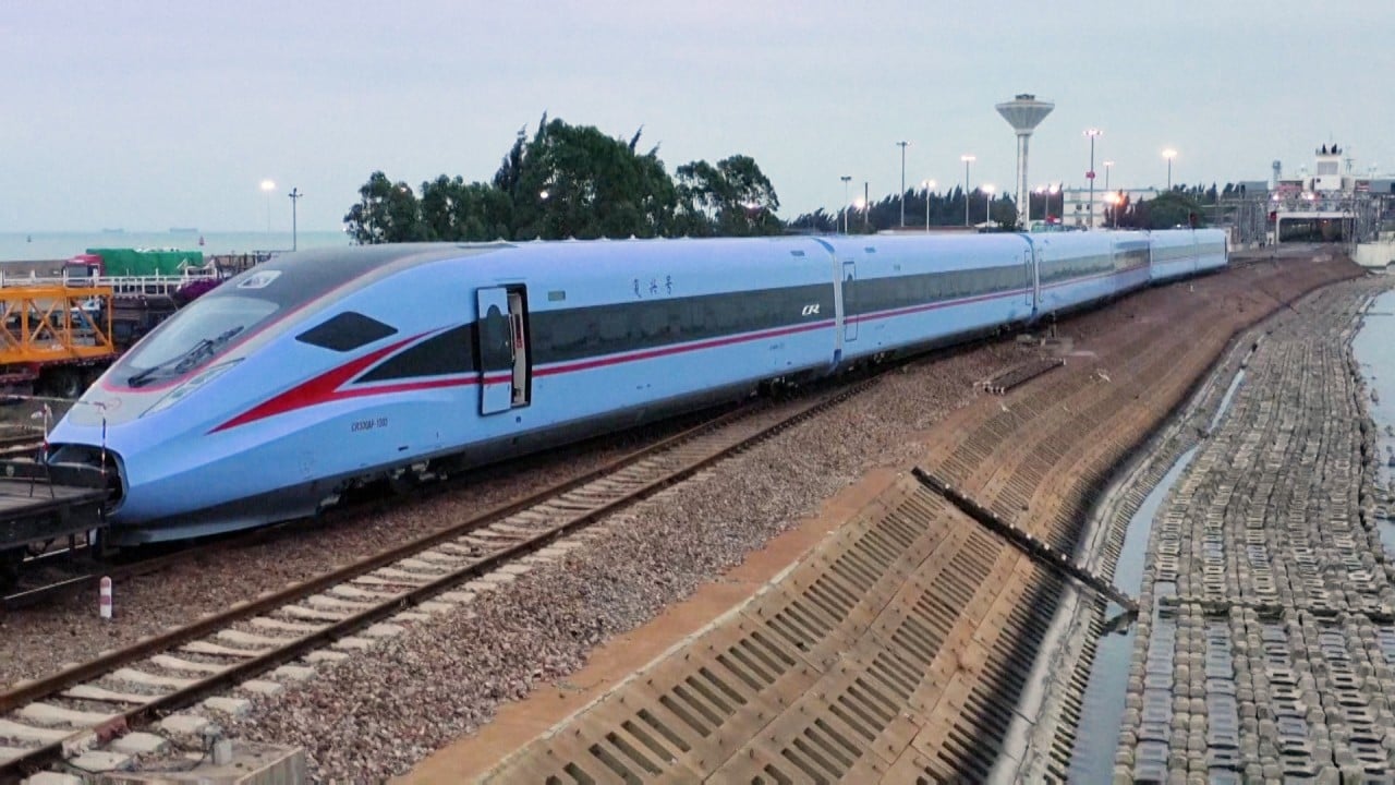 Blue high-speed trains match south China's Hainan island’s sky and sea
