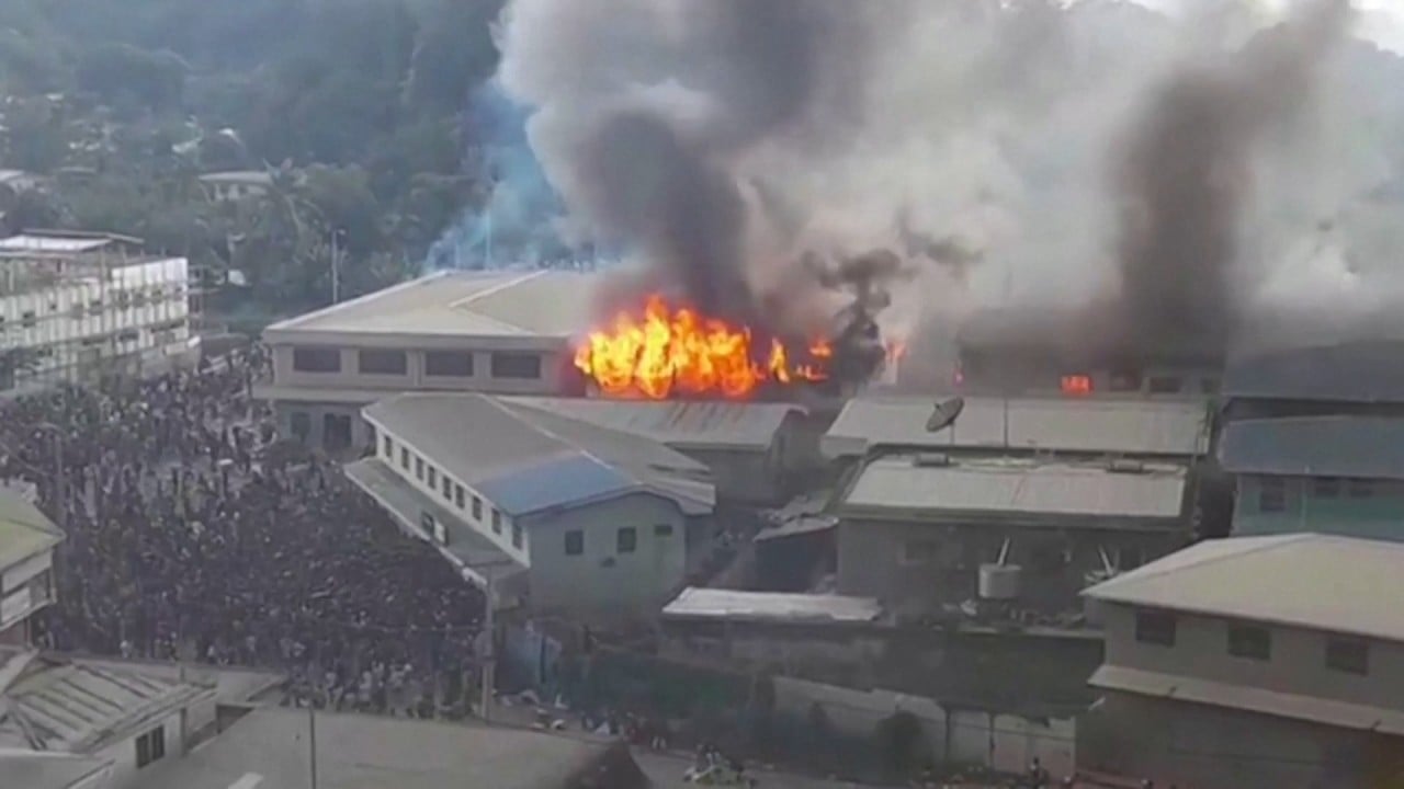 Solomon Islands riot sets Chinatown ablaze in capital Honiara as protests turn violent 