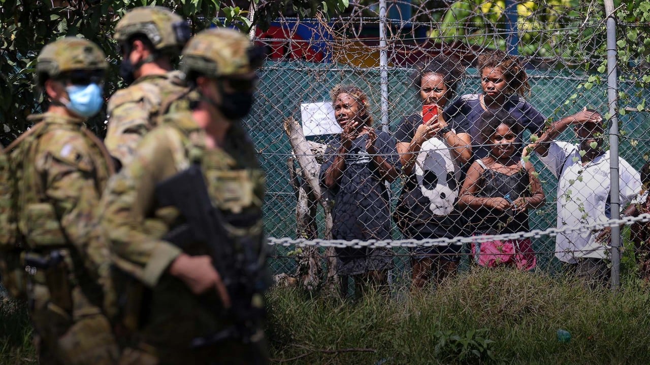 Australian troops and police deployed to Solomon Islands amid general unrest and Chinatown blaze