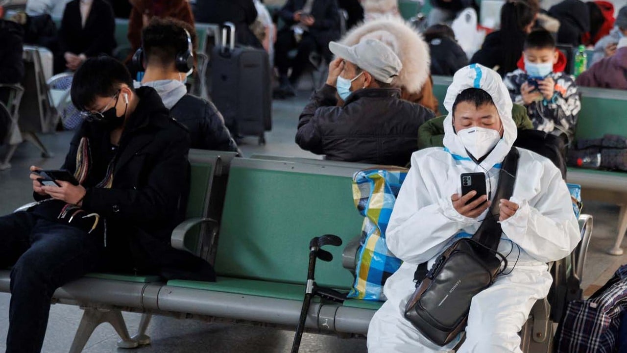 China says Covid outbreak has peaked as Lunar New Year travel rush returns in full swing