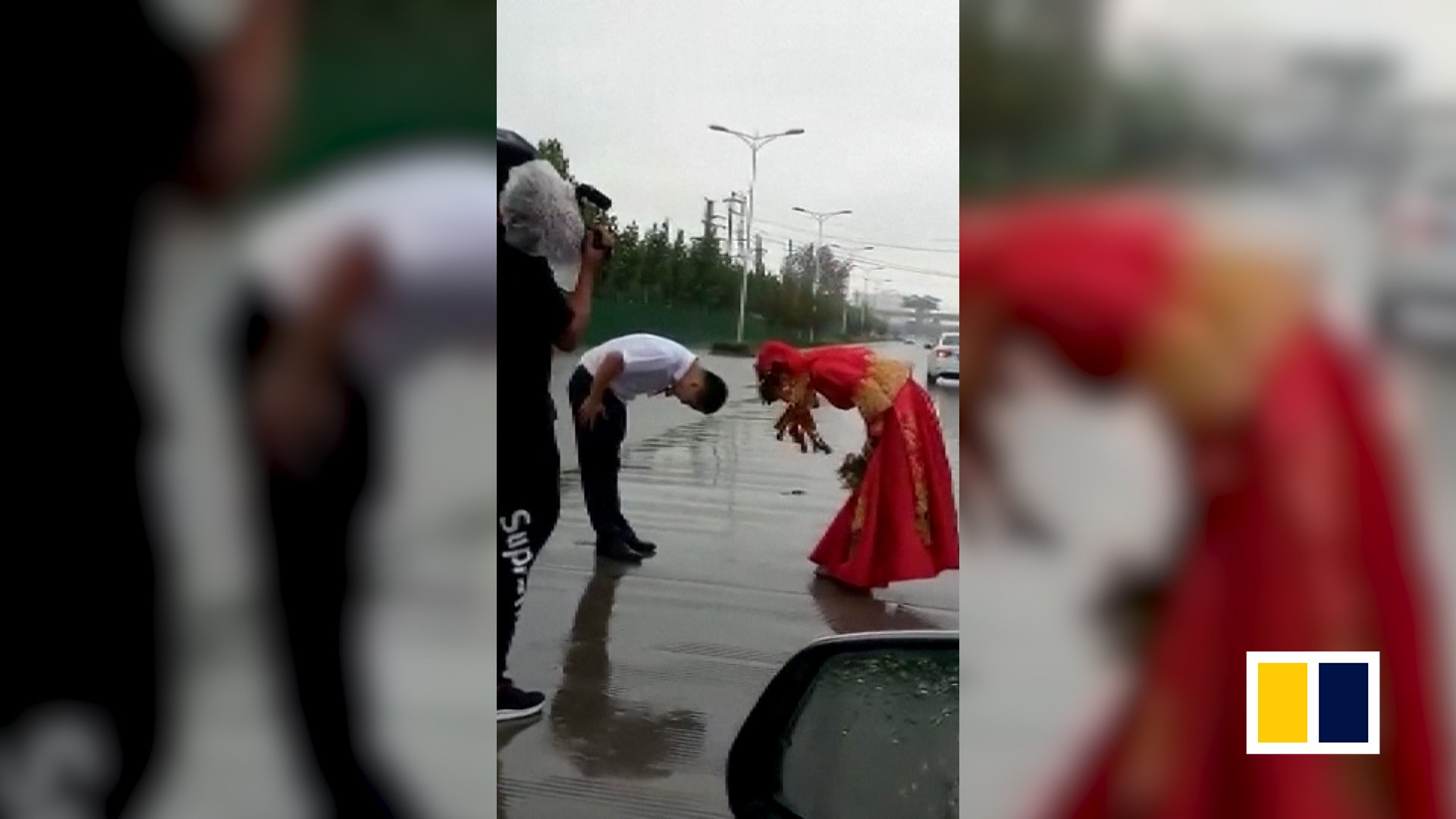 Chinese couples brave torrential rain to get married